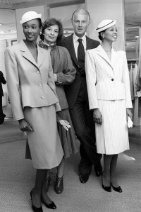 Hubert de Givenchy with models wearing skirtsuits from the Givenchy Fall/Winter 1979 collection.