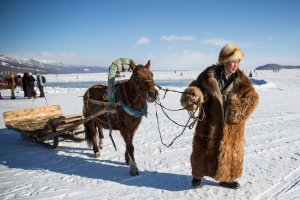 A Mongolian man waits for customers to take a sleigh ride at the Lake Khovsgol Ice Festival in Khatgal, Mongolia, on March 3, 2017.