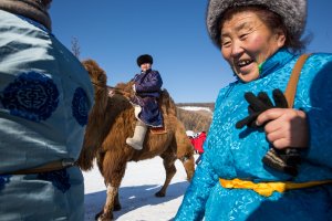 A Mongolian man rides a camel at the Lake Khovsgol Ice Festival in Khatgal, Mongolia, on March 3, 2017.