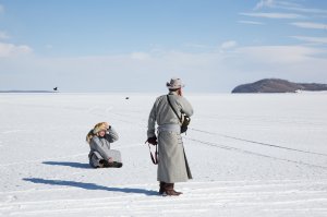 Mongolian men take a break from the Lake Khovsgol Ice Festival in Khatgal, Mongolia, on March 3, 2017.