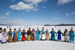 Traditionally dressed Mongolians stand for a photo at the Lake Khovsgol Ice Festival in Khatgal, Mongolia, on March 3, 2017.