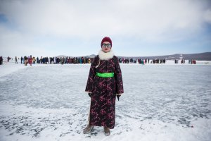 A Mongolian woman stands for a portrait at the Lake Khovsgol Ice Festival in Khatgal, Mongolia, on March 3, 2017.