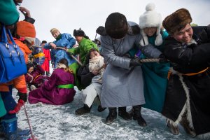 Mongolian men and women take part in a tug of war contest at the Lake Khovsgol Ice Festival in Khatgal, Mongolia, on March 3, 2017.