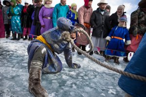 A Mongolian man reacts after losing a tug of war contest at the Lake Khovsgol Ice Festival in Khatgal, Mongolia, on March 3, 2017.