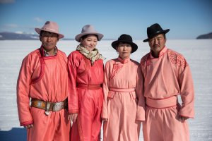 Two Mongolian couples, neighbors from a nearby town, stand for a portrait at the Lake Khovsgol Ice Festival in Khatgal, Mongolia, on March 4, 2017.