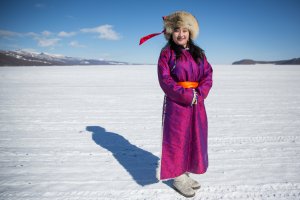 A Mongolian woman stands for a portrait at the Lake Khovsgol Ice Festival in Khatgal, Mongolia, on March 4, 2017.