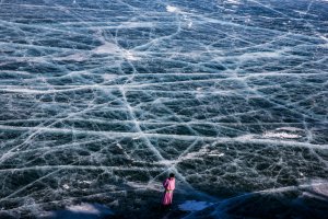A Mongolian man walks on the frozen surface of the lake near the Lake Khovsgol Ice Festival in Khatgal, Mongolia, on March 4, 2017.