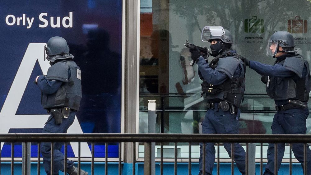 Armed police special intervention units move into position at Orly airport, near Paris, France, 18 March, 2017. According to news reports a person has been shot by Operation Sentinelle anti-terror patrol soldiers at Orly Airport after trying to snatch a soldier's weapon.Person shot after trying to take weapon from soldier, Orly, France - 18 Mar 2017