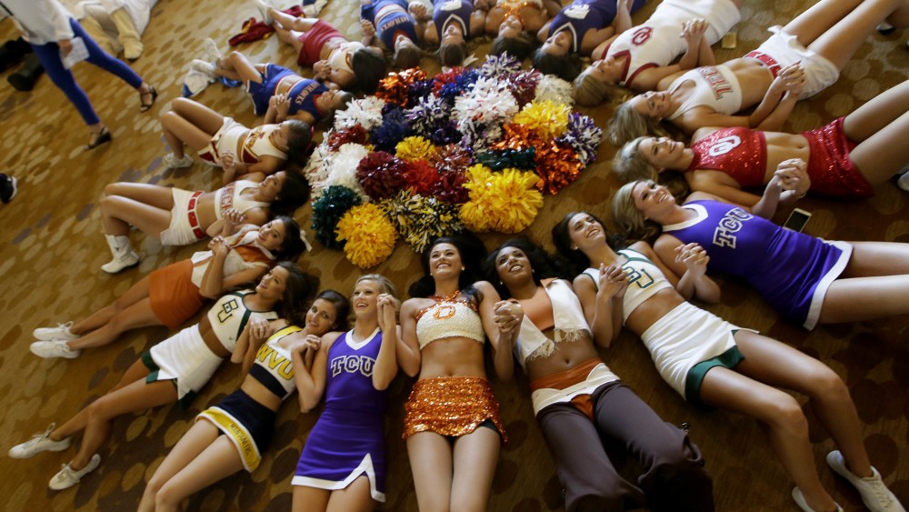 Copyright 2016 The Associated Press. All rights reserved. This material may not be published, broadcast, rewritten or redistributed without permission.Mandatory Credit: Photo by LM Otero/AP/REX/Shutterstock (5775306c)Cheerleaders circle up for a photo during the Big 12 college football media days in Dallas, Tuesday, July 19, 2016.BIG 12 College Football Media Days, Dallas, USA - 19 Jul 2016