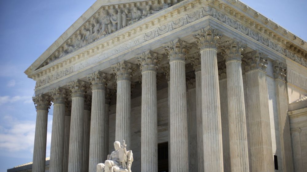 The Supreme Court building is seen in Washington. The Supreme Court, rejected an emergency appeal to stop Texas from enforcing its challenged voter ID law. But the court said it could revisit the issue as the November elections approachSupreme Court Voter ID Texas, Washington, USA