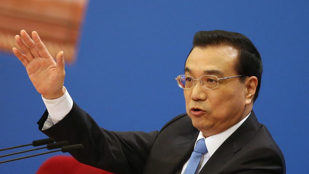 Chinese Premier Li Keqiang gestures during a press conference after the closing of the fifth Session of the 12th National People's Congress.