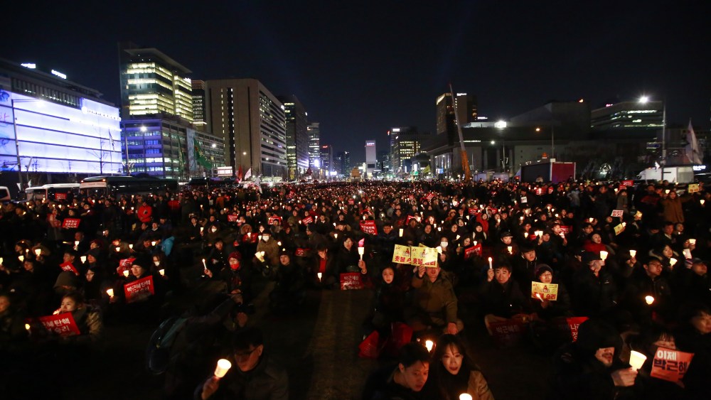 South Koreans gather while holding candles to celebrate after the court's ruling on the impeachment of South Korean President Park Geun-hye in downtown Gwanghwamun in Seoul, South Korea, 10 March 2017. Impeached South Korean President Park Geun-hye is to be permanently removed from office after the Constitutional Court announced its ruling on 10 March. A snap election is expected to take place in early May 2017.Court announces ruling on South Korean President Park impeachment, Seoul, Korea - 10 Mar 2017