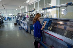 An employee at Sor Cashmere LLC works in the digital weaving station. (Credit: Dene-Hern Chen)