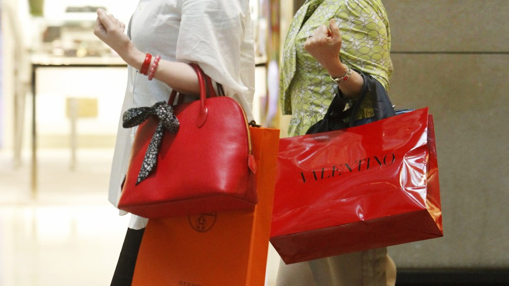 Mainland Chinese Tourists Are Seen with Luxury Brand Shopping Bags in Hong Kong China 17 May 2011 the Strength of the Chinese Yuan Against the Hong Kong Dollar Makes Shopping in Hong Kong Inexpensive For the Emerging Middle Classes of China who Often Travel to Hong Kong to Buy Luxury Goods and Even Apartments in the City China Hong KongChina Hong Kong Luxury Shopping - May 2011