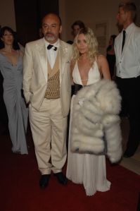 Christian Louboutin, left, and actress Ashley Olsen attend the Metropolitan Museum of Art's annual Costume Institute gala in New York City. Olsen wears vintage Galanos.Met Costume Institute Gala Inside, New York