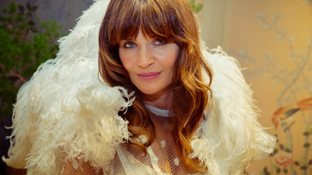 Helena Christensen, wearing one of the capes.