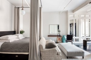The master bedroom comes with an exposed brick wall, an architectural column, eight closets and an en-suite bathroom.