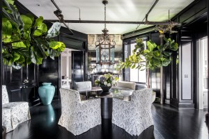 It has a decorative fire place and built-in cabinetry for storage.