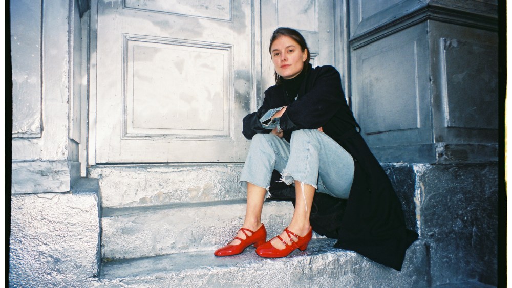 Carel's signature red mary-jane shoes.
