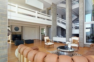 Features of the four-bedroom, two-bathroom property include spacious rooms, vaulted ceilings, three fireplaces, brick walls and large windows which allow lots of natural light.