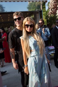 Paris Hilton and boyfriend Chris Zylka at Philipp Plein's show at his villa during Cannes Film Festival.