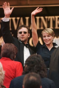 BASINGER CROWE US actress Kim Basinger, right, and Australian actor Russel Crowe waves to fans as they arrive for the screening of Curtis Hanson's film " L.A Confidential " in competition for the Cannes Film FestivalFRANCE CANNES FESTIVAL, CANNES, France