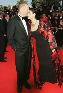 WILLIS MOORE US actor Bruce Willis kisses his wife Demi Moore on the steps of the Cannes Film festival palace in Cannes, for the screening of French movie " The Fifth Element", for the opening of the 50th International film festival. " The Fifth Element is out of competitionFRANCE CANNES FESTIVAL, CANNES, France