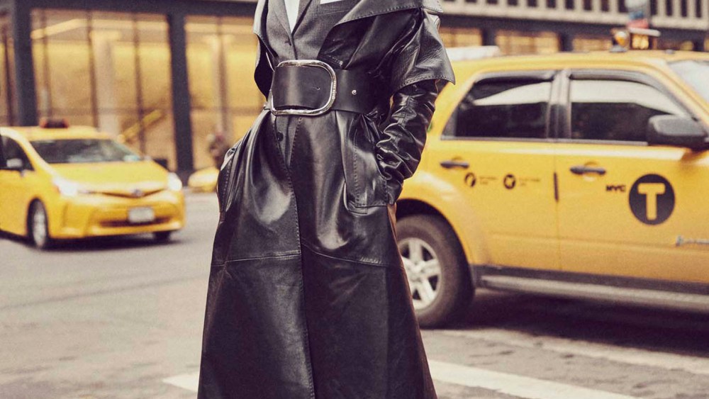 Mugler’s lambskin trenchcoat over Neil Barrett’s wool jumpsuit and Dries Van Noten’s cotton button-down (worn throughout). Zana Bayne belt (worn throughout); Manolo Blahnik boots (worn throughout); Elizabeth Kennedy earrings (worn throughout).