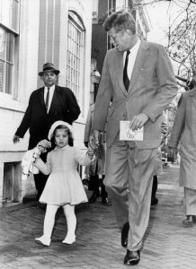 Washington, D.C.: November 27, 1960 President-elect Kennedy walks with his daughter Caroline on their way to church services on her third birthday. Afterwards Kennedy went to Georgetown Hospital to visit his wife and their new-born son.VARIOUS