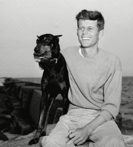 John F. Kennedy, winner of the Democratic Nomination for Congress in the 11th Massachusetts District, relaxes with his dog, Mo, Hyannisport, MassJohn F Kennedy and Dog 1946, Hyannisport, USA