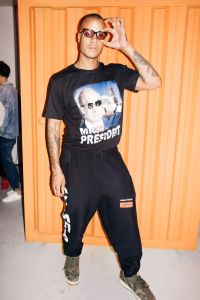 Heron Preston in a T-shirt depicting Vladimir Putin.