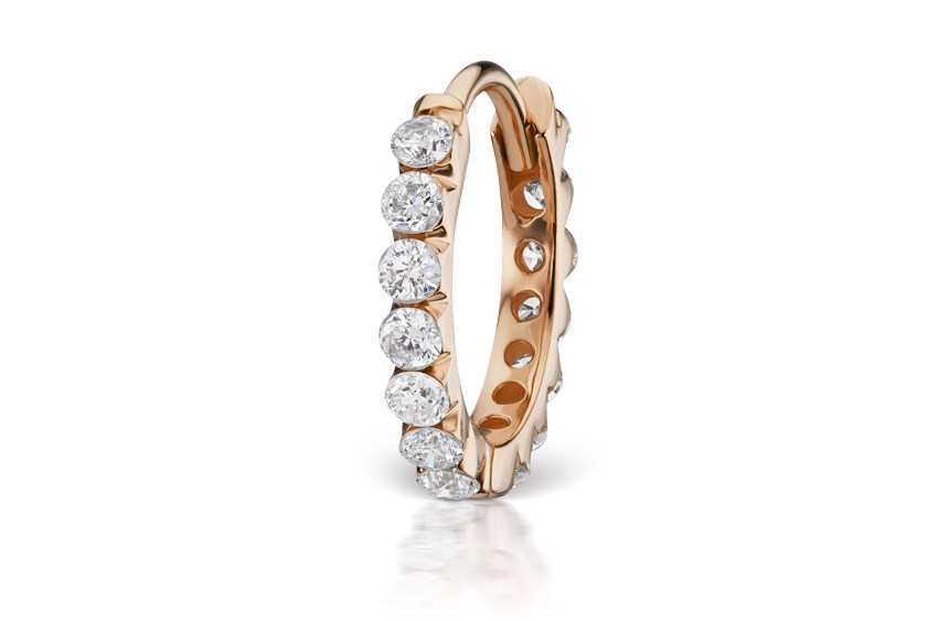 A rose gold and diamond earring designed by Maria Tash.