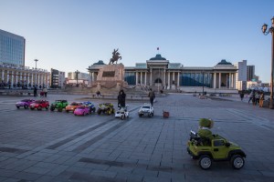 A Mongolian child rides a toy car at Chinggis Square in Ulaanbaatar, Mongolia on March 19, 2017. Photographer: Taylor Weidman