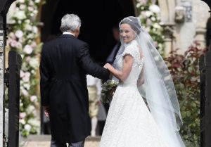 Pippa Middleton wedding Pippa Middleton (in Giles Deacon) arrives with her father Michael Middleton