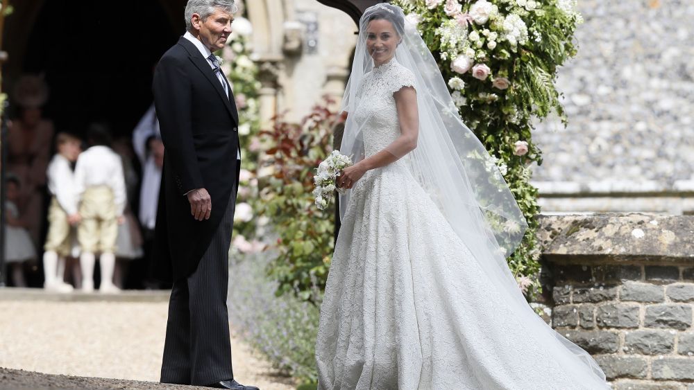 Pippa Middleton wedding Pippa Middleton (in Giles Deacon) arrives with her father Michael Middleton