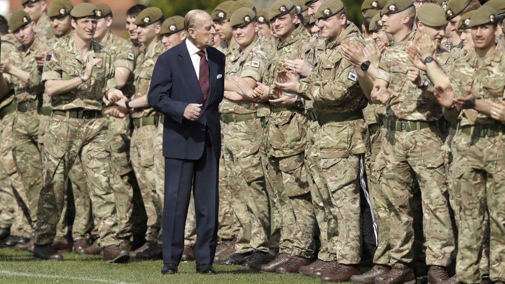 Prince Philip, in his capacity of Colonel, Grenadier Guards, chats with members of the 1st Battalion Grenadier Guards as they applaud the final whistle from the sidelines, of the Manchester Cup inter-company football match at Lille BarracksManchester Cup inter-company football match, Lille Barracks, Aldershot, UK - 30 Mar 2017The Duke of Edinburgh on Thursday presented the Manchester Trophy to the winners of the Manchester Cup, met Sergeants' in their Mess and stayed for lunch in the Officers' Mess