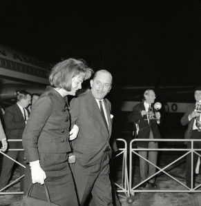Jacqueline Kennedy links arms with her brother-in-law Prince Stanislav Radziwill, as they walk across the tarmac at London Airport after she arrived from New York on . The widow of the late American President is on her way to the Adriatic for a cruise along the Dalmatian coastEngland Jacqueline Kennedy and Prince Radziwill