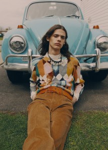 Prada’s wool sweater and cotton corduroy pants. Prada large shell necklace and belt.