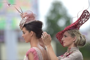 Racegoers help each other out as they arrive for Ladies Day at Ascot Racecourse.
Royal Ascot, Day Three, Ladies Day.