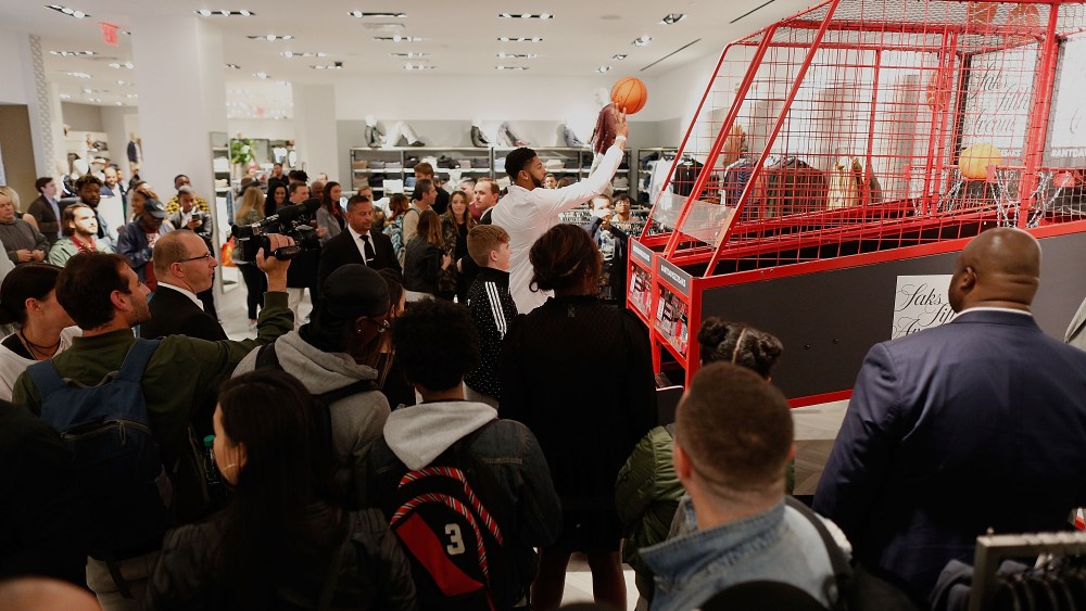Anthony Davis shows off his skills on the Pop-A-Shot machine.