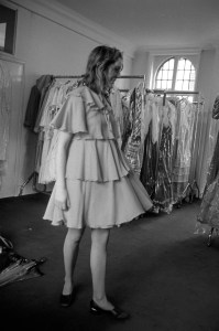 Model wearing a flowing, tiered cocktail dress from British designer Gina Fratini's Fall 1972 RTW collection