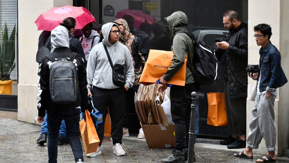 People queueing for the Louis Vuitton x Supreme launch in Paris.