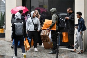 People queueing for the Louis Vuitton x Supreme launch in Paris.