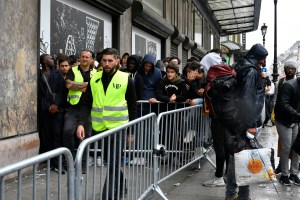 People queueing for the Louis Vuitton x Supreme launch in Paris.