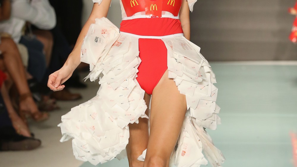 MIAMI, FL - JULY 20:  A model walks the runway at McDCouture Makes A Splash At Miami Swim Week at 2100 Collins Ave. on July 20, 2017 in Miami, Florida. McDonalds McDCouture left the crowd at Miami Swim Week hungry for more than a Big Mac and fries. One of 21 one-of-a-kind mens and womens designs created from McDonalds packaging and paper goods by Miami International University of Art fashion students.  (Photo by Alexander Tamargo/Getty Images for McDonald's)