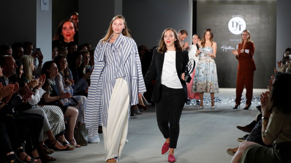 : Designer Lara Krude (R) is seen with a model on the runway after accepting the fashion talent award 'Designer for Tomorrow' by Peek & Cloppenburg and Fashion ID hosted by Stella McCartney during the Mercedes-Benz Fashion Week Berlin Spring/Summer 2018 at Kaufhaus Jandorf on July 6, 2017 in Berlin, Germany. (Photo by Andreas Rentz/Getty Images for P&C and Fashion ID) *** Local Caption *** Lara Krude