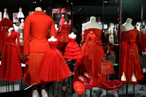 Designs by Raf Simons, John Galliano, Christian Dior and Marc Bohan in a chromatic display in the Dior exhibition at Les Arts Décoratifs.  