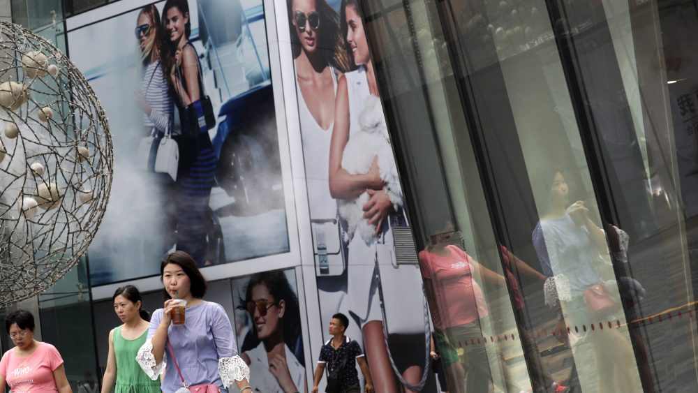 China's economic growth held steady in the latest quarter, boosted by unexpectedly strong trade and consumer spending, despite fears tighter lending controls aimed at cooling a surge in debt are weighing on commercial activity.