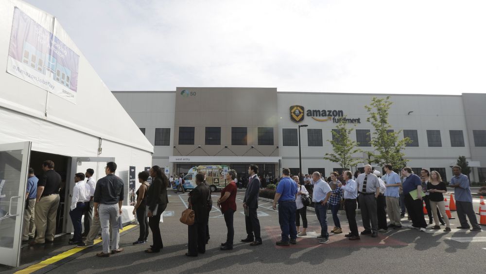 Job candidates form a line during a job fair at the Amazon Fulfillment center in Robbinsville Township, N.J., . Amazon held a nation-wide job fair at its warehouses on Aug. 2Amazon warehouse job fair, Robbinsville Township, USA - 02 Aug 2017