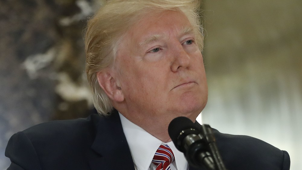 President Donald Trump looks away as he listens to a questions from members of the media in the lobby of Trump Tower, in New YorkTrump, New York, USA - 15 Aug 2017